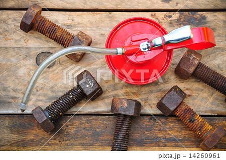 Oil can on wooden background, Lube oil can and used in industry or hard works. 14260961