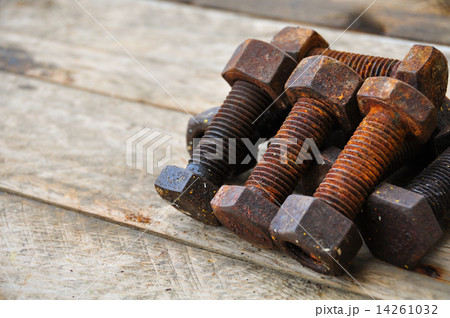 Old bolts or dirty bolts on wooden background, Machine equipment in industry work. 14261032