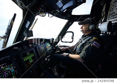 helicopter pilot in flight for oil rig operation 14264598