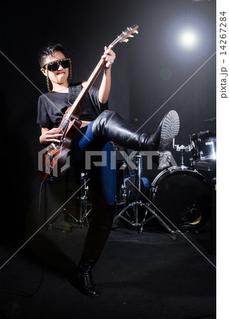 Woman guitar player during concert 14267284