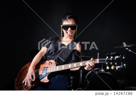 Woman guitar player during concert 14267286