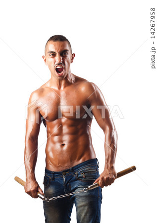 Man in martial arts concept with nunchucks 14267958