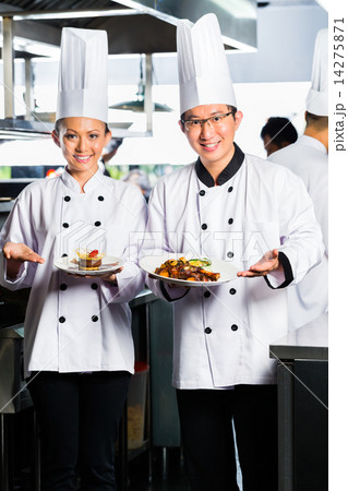 Asian Chef in restaurant kitchen cooking 14275871