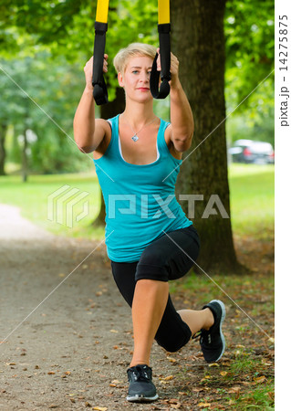 woman doing suspension sling trainer sport 14275875