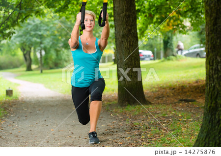 woman doing suspension sling trainer sport 14275876