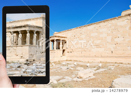 tourist taking photo of monument at acropolis 14278979
