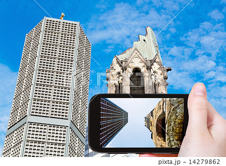 tourist taking photo of gedachtniskirche in Berlin 14279862