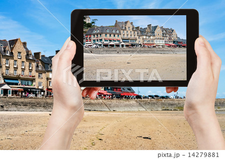 tourist taking photo of waterfront in Cancale tourist taking photo of waterfront in Cancale 14279881