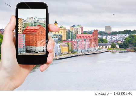 tourist taking photo of waterfront in Stockholm tourist taking photo of waterfront in Stockholm 14280246