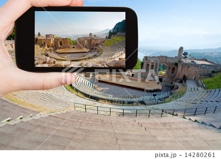 tourist taking photo of ancient amphitheater tourist taking photo of ancient amphitheater 14280261