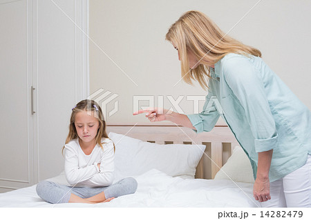 Upset mother scolding her daughter 14282479
