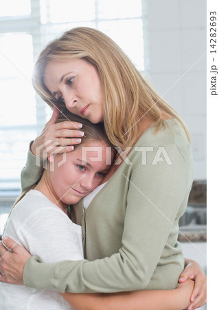 Sad little girl hugging her mother Sad little girl hugging her mother 14282693