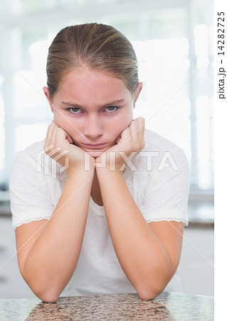 Upset little girl looking at camera 14282725