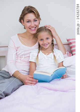 Mother with her daughter at bedtime 14282784