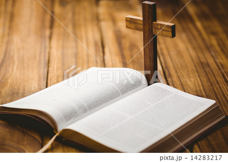 Open bible with crucifix icon behind Open bible with crucifix icon behind 14283217