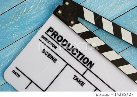 Movie slate film on blue wooden table Movie slate film on blue wooden table 14285427