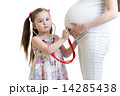 kid girl listening to pregnant mother tummy 14285438