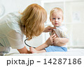 pediatrician examining heartbeat of kid with stethoscope 14287186