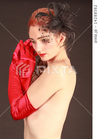 Young dreamy woman with bare breasts covered 14288562