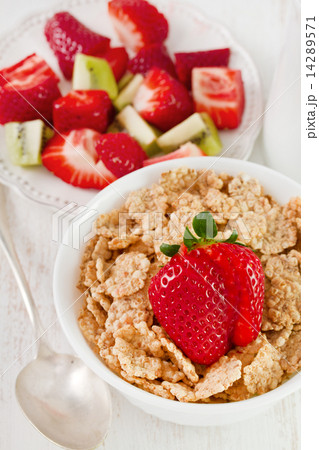 cereals with strawberry in white bowl cereals with strawberry in white bowl 14289571