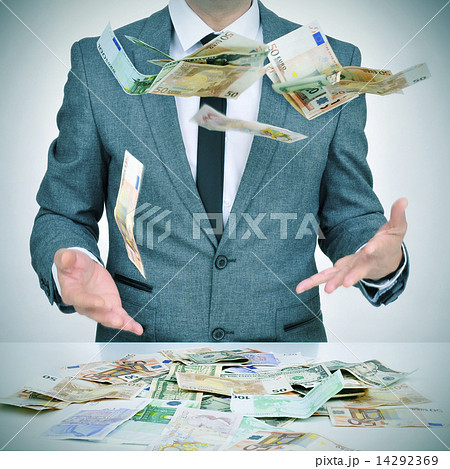 man trying to catch money falling from the sky man trying to catch money falling from the sky 14292369