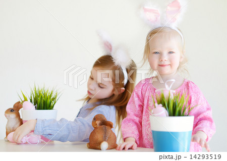 Two sisters wearing bunny ears on Easter Two sisters wearing bunny ears on Easter 14293519