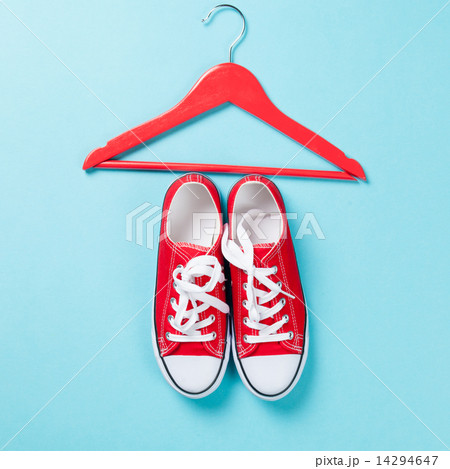 Red gumshoes with white shoelaces and hanger 14294647
