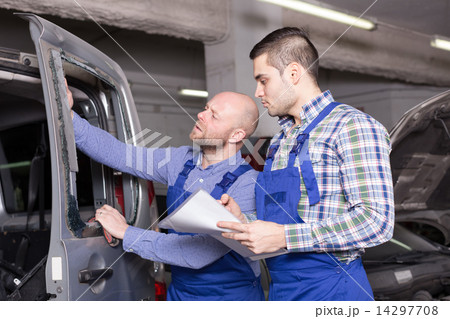 Workman calculating the price Workman calculating the price 14297708