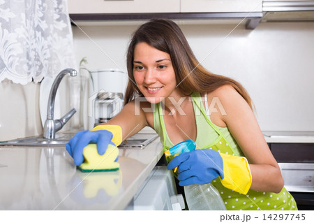 Woman cleaning kitchen 14297745