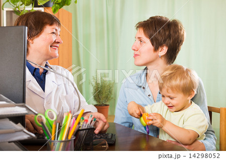 Doctor examining baby Doctor examining baby 14298052