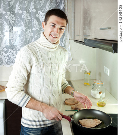 man frying steak of fish man frying steak of fish 14298408