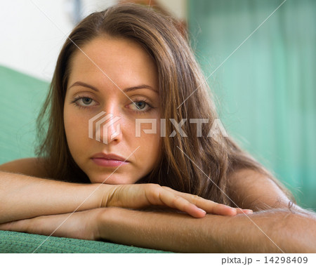 Depressed woman on sofa 14298409