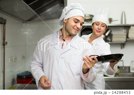 Head-cooks cooking at professional kitchen 14298453