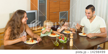 happy family of four having lunch 14298499