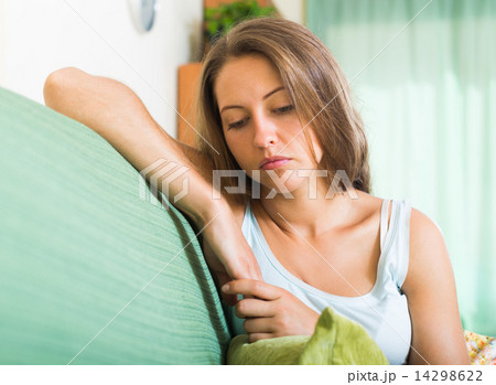 Sad woman on sofa 14298622