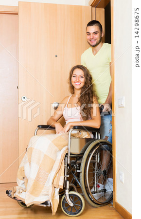 Worker brought person in wheelchair 14298675