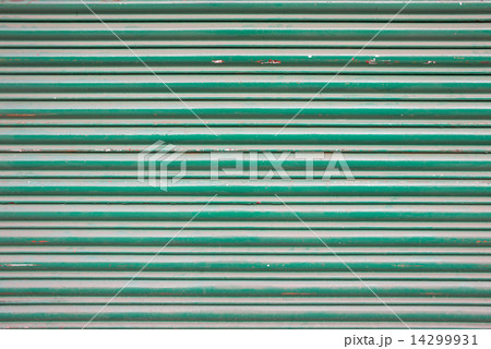Large green metallic tin stripy fence background with scratches 14299931