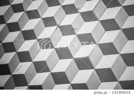 Old black and white tiling on floor, cubic pattern 14299950