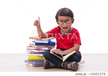Cute boy reading a book Cute boy reading a book 14301579