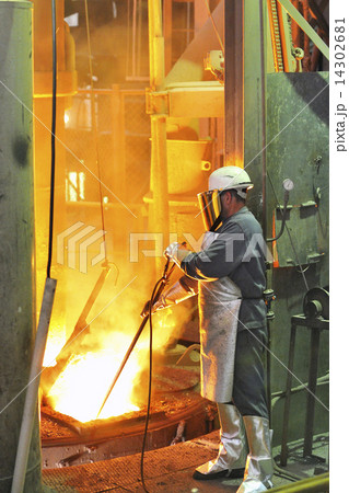 mill worker with hot steel mill worker with hot steel 14302681