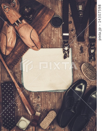 Shoe care and gentleman's accessories on a wooden table 14307598