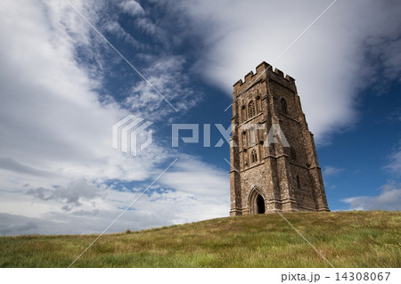 Tourists exploring the ruins of St. Michael's Tower at the top of glastonbury tor in somerest  14308067