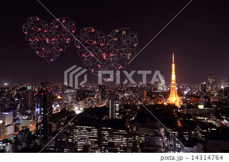 heart sparkle Fireworks celebrating over Tokyo cityscape at nigh 14314764