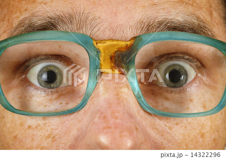 Eyes of surprised person in old spectacles Eyes of surprised person in old spectacles 14322296