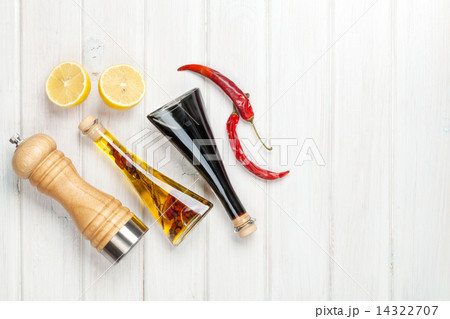 Condiments and spices over white wooden table Condiments and spices over white wooden table 14322707