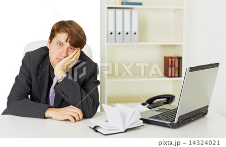Man doing nothing at work in office 14324021