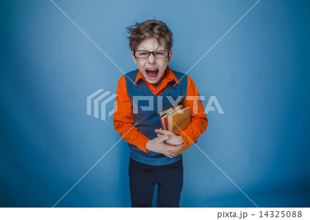 teenager boy brown hair European appearance in retro clothes wit 14325088