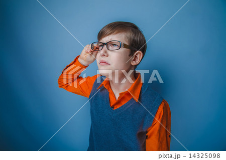 boy teenager European appearance in brown hair retro dress holds 14325098