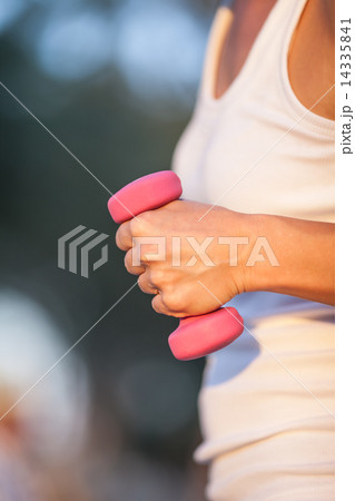 with dumbbells in hand 14335841