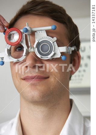 Man Having Sight Test At Optometrist Man Having Sight Test At Optometrist 14337181